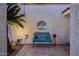 Cozy front porch seating area featuring a stylish metal bench and decorative accessories at 6320 E Kings Ave, Scottsdale, AZ 85254