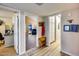 Hallway with view to living room and office, with hardwood floors and neutral paint at 6320 E Kings Ave, Scottsdale, AZ 85254