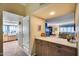 Pass through features a snack bar and a view into the kitchen and living room at 6320 E Kings Ave, Scottsdale, AZ 85254