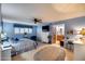 Bright main bedroom with blue walls, ceiling fan, and ensuite bathroom access at 6320 E Kings Ave, Scottsdale, AZ 85254