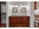 Bathroom vanity with double sinks, granite countertops, and framed mirrors for a luxurious feel at 6838 E Almeria Rd, Scottsdale, AZ 85257