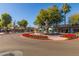 View of a retail center featuring a fountain and red flowers at 6838 E Almeria Rd, Scottsdale, AZ 85257