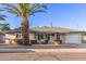 Charming single-story home with mature palm trees and a well-maintained front yard at 6838 E Almeria Rd, Scottsdale, AZ 85257