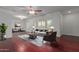 Bright and airy living room with hardwood floors, plantation shutters, and stylish furnishings at 6838 E Almeria Rd, Scottsdale, AZ 85257