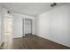 Bright bedroom with wood-look tile flooring and spacious closet at 7030 W Cypress St, Phoenix, AZ 85035