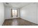 Well-lit bedroom featuring wood-look tile floors at 7030 W Cypress St, Phoenix, AZ 85035