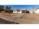 House exterior with driveway and front yard at 7030 W Cypress St, Phoenix, AZ 85035