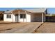 Single story home with carport and front yard at 7030 W Cypress St, Phoenix, AZ 85035