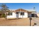 Single story home with carport and front yard at 7030 W Cypress St, Phoenix, AZ 85035