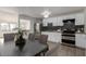 Modern kitchen with white cabinets and dark countertops at 7030 W Cypress St, Phoenix, AZ 85035