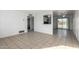 Spacious living area with tile floors and kitchen access at 7030 W Cypress St, Phoenix, AZ 85035