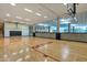 Indoor basketball court with hardwood floors and glass walls at 7161 E Rancho Vista Dr # 3002, Scottsdale, AZ 85251