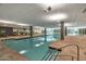 Indoor swimming pool and spa with lounge area at 7161 E Rancho Vista Dr # 3002, Scottsdale, AZ 85251