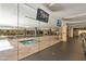 Indoor pool and hot tub viewed through glass walls at 7161 E Rancho Vista Dr # 3002, Scottsdale, AZ 85251