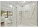 Spa-like shower with marble surround and glass enclosure at 7161 E Rancho Vista Dr # 3002, Scottsdale, AZ 85251