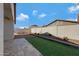 Landscaped backyard with a patio and block wall at 7206 W Wood St, Phoenix, AZ 85043