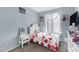 Cozy bedroom with polka dot bedding and white nightstand at 7206 W Wood St, Phoenix, AZ 85043