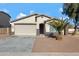 Charming one-story house with a two-car garage and a palm tree at 7206 W Wood St, Phoenix, AZ 85043