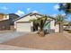 One-story house with a two-car garage and nicely landscaped yard at 7206 W Wood St, Phoenix, AZ 85043