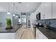 Modern kitchen with white cabinets, granite countertops, and island at 7206 W Wood St, Phoenix, AZ 85043