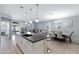 Open kitchen with a large island and white cabinets at 7206 W Wood St, Phoenix, AZ 85043