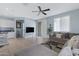 Spacious living room with gray sectional sofa and large TV at 7206 W Wood St, Phoenix, AZ 85043