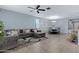 Open living room featuring a gray sectional and dining area at 7206 W Wood St, Phoenix, AZ 85043