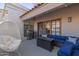 Spacious patio with seating area and hanging chair at 7800 E Lincoln Dr # 2004, Scottsdale, AZ 85250