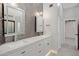 Modern bathroom with double vanity and herringbone tile at 810 S Lagoon Dr, Gilbert, AZ 85233