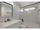 Contemporary bathroom with hexagon tile and a white vanity at 810 S Lagoon Dr, Gilbert, AZ 85233