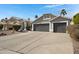 Two-story house with gray exterior and a two-car garage at 810 S Lagoon Dr, Gilbert, AZ 85233