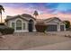 Gray two-story house with a two-car garage and desert landscaping at 810 S Lagoon Dr, Gilbert, AZ 85233