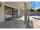 Covered patio with sliding glass doors and herringbone-pattern tile flooring at 810 S Lagoon Dr, Gilbert, AZ 85233