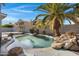 Relaxing pool area with a palm tree and spacious patio at 810 S Lagoon Dr, Gilbert, AZ 85233