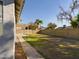 Backyard with grassy area and partial view of the house at 8623 W Athens St, Peoria, AZ 85382