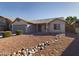 House exterior features a covered patio and landscaped yard at 8623 W Athens St, Peoria, AZ 85382