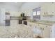 Spacious kitchen with granite countertops and an island at 8623 W Athens St, Peoria, AZ 85382