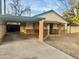 Brick home with carport and landscaped yard at 1006 E Pasadena Ave, Phoenix, AZ 85014