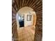 Hallway with tile floors and brick archway at 1006 E Pasadena Ave, Phoenix, AZ 85014