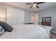 Bedroom with white doors, a dresser, and a white bed frame at 10110 W Redbird Rd, Peoria, AZ 85383