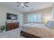 Main bedroom with king bed, dresser, and patio access at 10110 W Redbird Rd, Peoria, AZ 85383