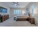 Main bedroom with king bed, TV, and walk-in closet at 10110 W Redbird Rd, Peoria, AZ 85383