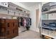 Large walk-in closet with custom shelving and drawers at 10110 W Redbird Rd, Peoria, AZ 85383