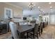 Open concept dining room with view into the living room at 10110 W Redbird Rd, Peoria, AZ 85383