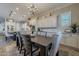 Open dining room with a large table and chandelier at 10110 W Redbird Rd, Peoria, AZ 85383