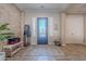 Bright and spacious entryway with wood-look tile flooring at 10110 W Redbird Rd, Peoria, AZ 85383