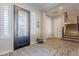 Elegant entryway showcasing a statement iron door and hardwood floors at 10110 W Redbird Rd, Peoria, AZ 85383