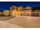 Stunning two-story home with a brick facade and three-car garage at 10110 W Redbird Rd, Peoria, AZ 85383