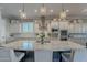 Large kitchen island with granite countertops and pendant lighting at 10110 W Redbird Rd, Peoria, AZ 85383