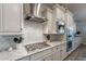 Well-equipped kitchen featuring gas cooktop and custom cabinetry at 10110 W Redbird Rd, Peoria, AZ 85383